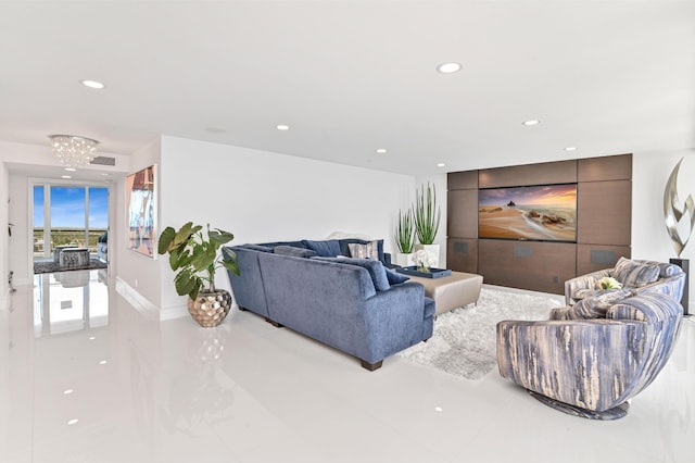 living room featuring a notable chandelier