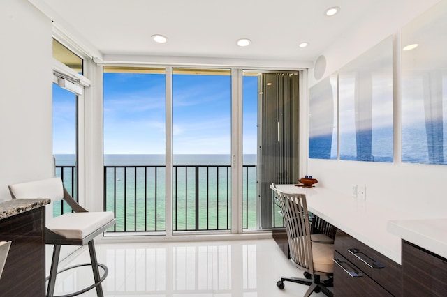 office area featuring built in desk and a water view