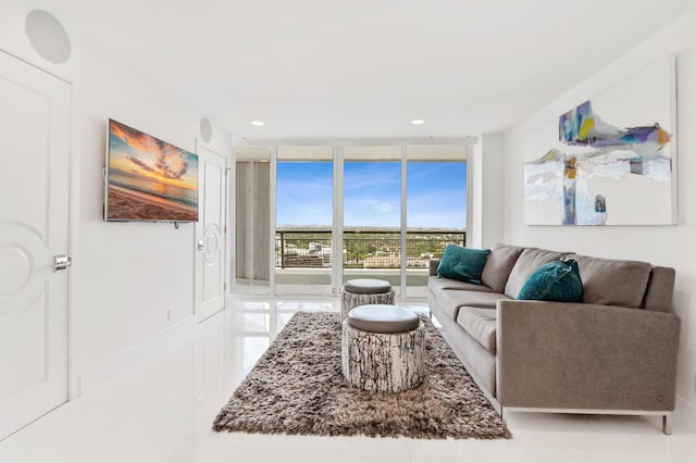 living room with floor to ceiling windows