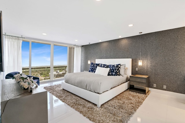 bedroom featuring floor to ceiling windows