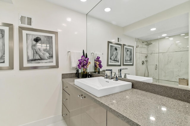 bathroom with vanity and walk in shower