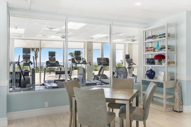 dining space with light hardwood / wood-style floors