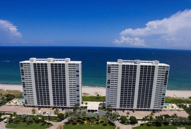 birds eye view of property featuring a water view and a view of the beach