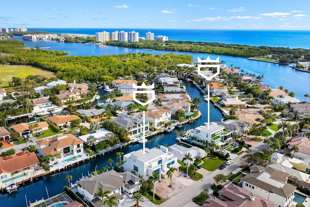 birds eye view of property with a residential view and a water view