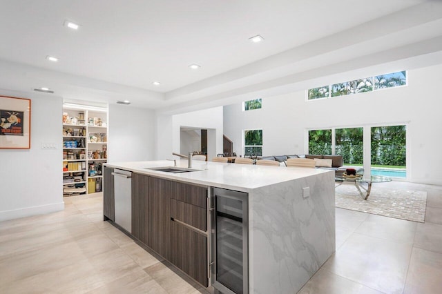 1145 SW 20th St, Boca Raton, FL 33486 - kitchen with a kitchen island with sink, a sink, wine cooler, dishwasher, and modern cabinets