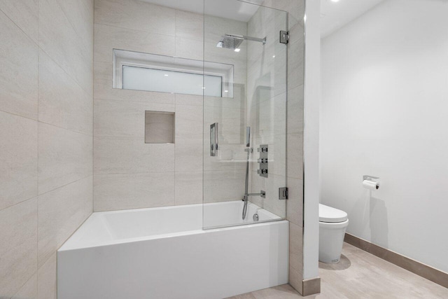 bathroom featuring toilet and tile patterned flooring