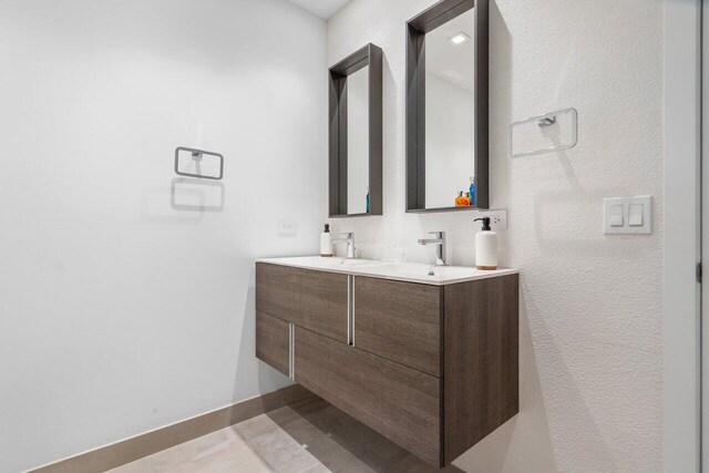 bathroom with vanity and tile patterned floors