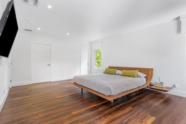 bedroom featuring dark hardwood / wood-style flooring