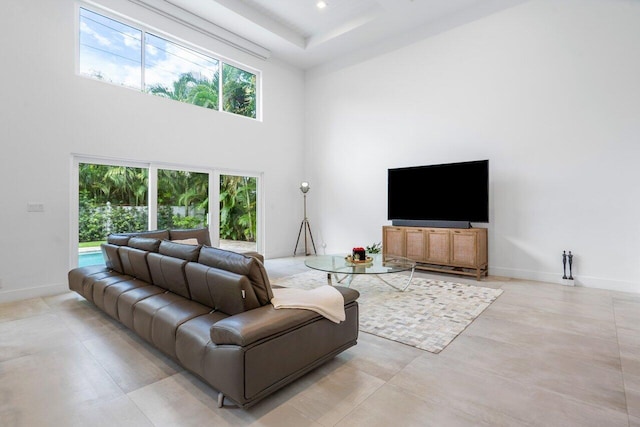 living room with a high ceiling