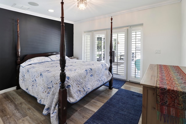 bedroom with access to outside, dark hardwood / wood-style floors, and crown molding