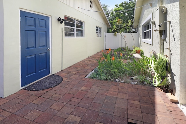 entrance to property with a patio