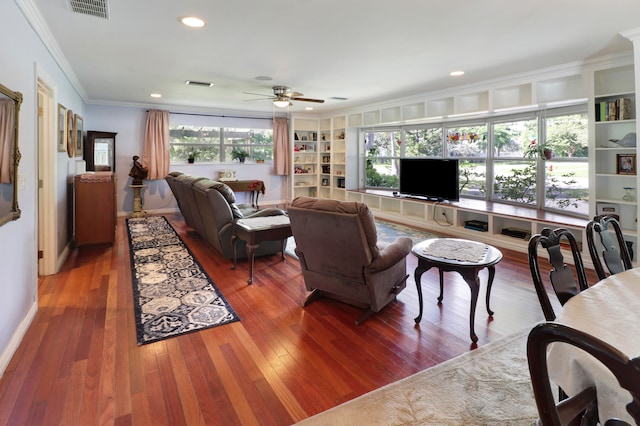 living room with built in features, crown molding, ceiling fan, and hardwood / wood-style floors