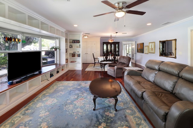 living room featuring ceiling fan, dark hardwood / wood-style floors, and crown molding