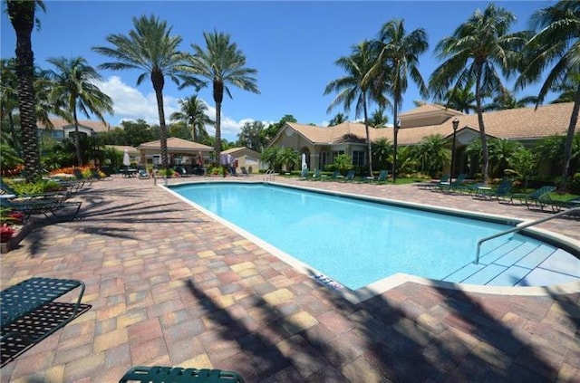 view of swimming pool with a patio