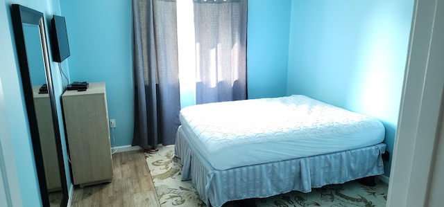 bedroom featuring light wood-type flooring