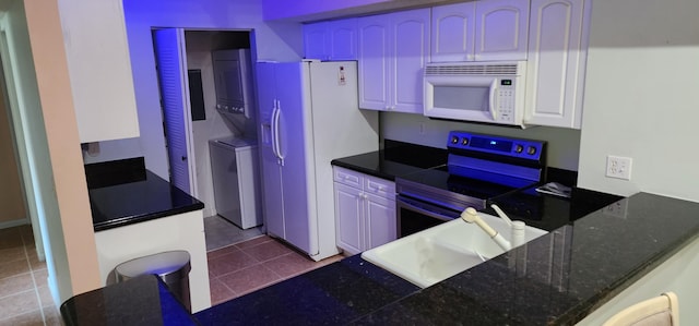 kitchen featuring white cabinets, white appliances, sink, and tile patterned floors