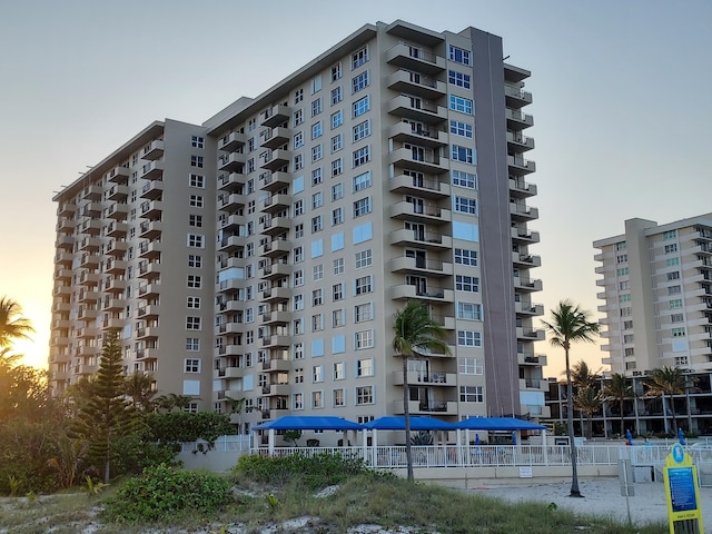 view of outdoor building at dusk