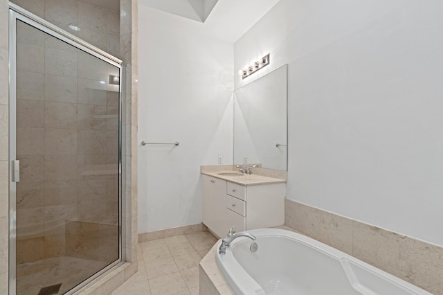 bathroom featuring tile patterned floors, vanity, and shower with separate bathtub