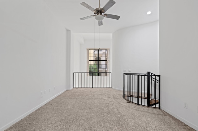 carpeted empty room with ceiling fan