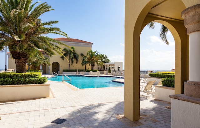 view of pool featuring a patio