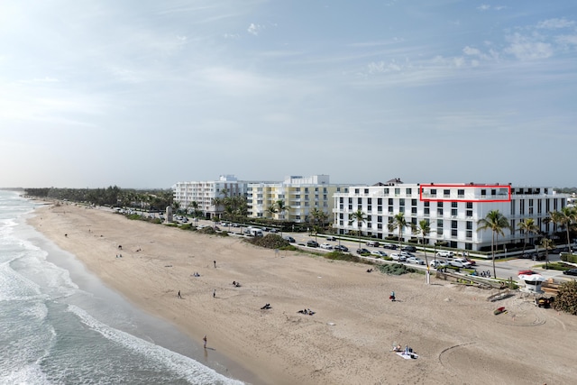 aerial view with a view of the beach and a water view