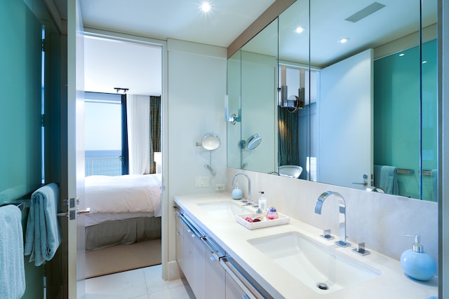 bathroom featuring tile patterned floors and double sink vanity