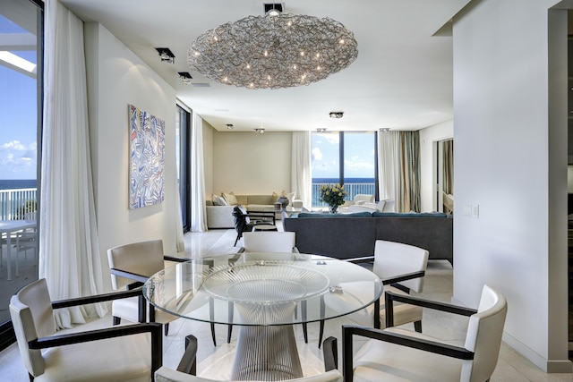 living room featuring floor to ceiling windows and light tile patterned floors