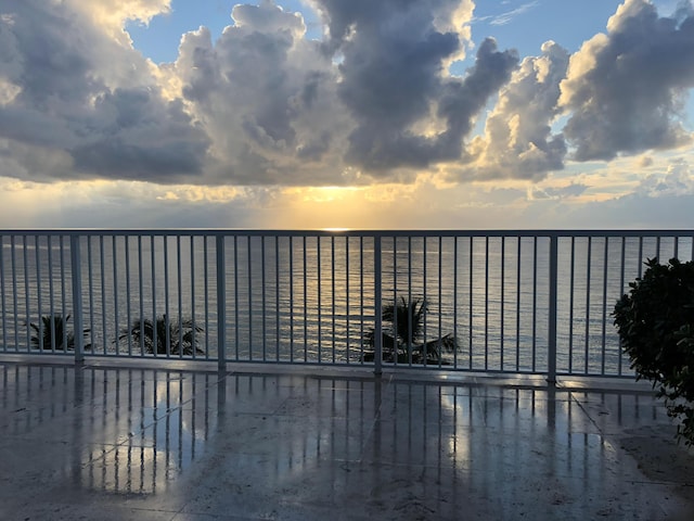 pool at dusk with a water view