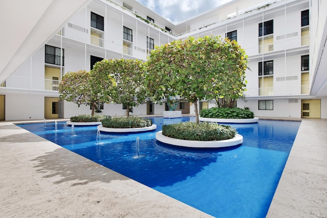 view of pool with pool water feature