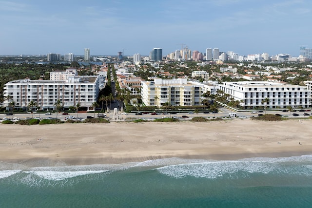 aerial view featuring a water view and a beach view