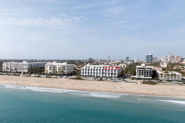 bird's eye view with a view of the beach and a water view