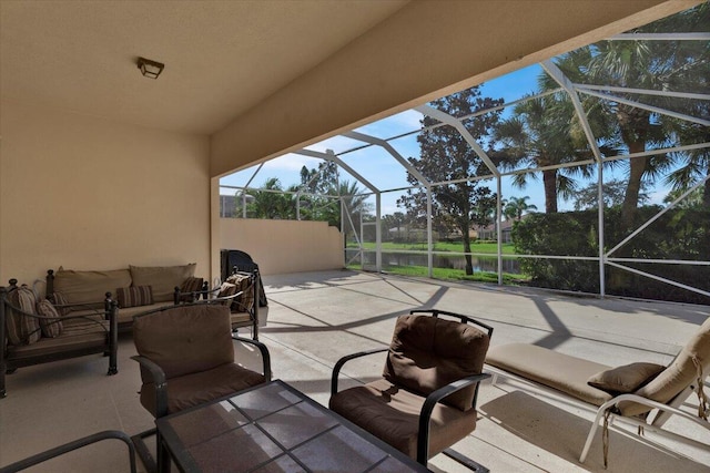 view of patio / terrace with glass enclosure and an outdoor living space