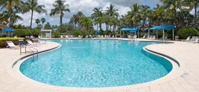 community pool featuring a patio area