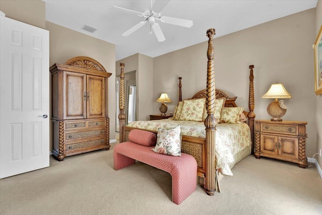 bedroom with a ceiling fan, light carpet, visible vents, and baseboards