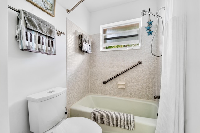 bathroom with toilet and shower / bath combo with shower curtain