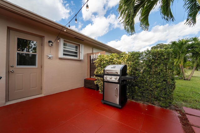 view of patio featuring a grill