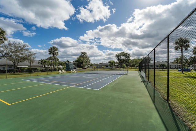 view of sport court with basketball hoop