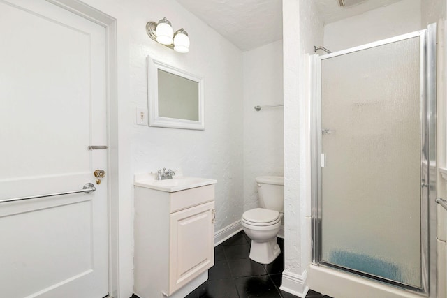 bathroom with tile patterned flooring, a shower stall, baseboards, toilet, and vanity