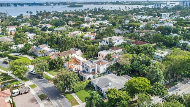 drone / aerial view featuring a residential view and a water view