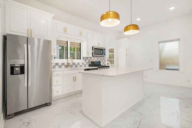 kitchen featuring decorative backsplash, marble finish floor, and stainless steel appliances