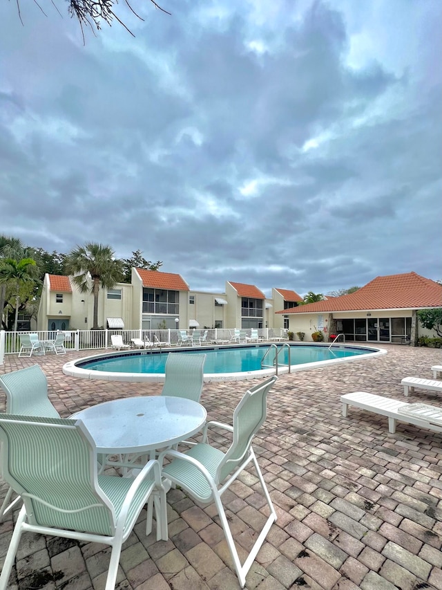 view of swimming pool featuring a patio