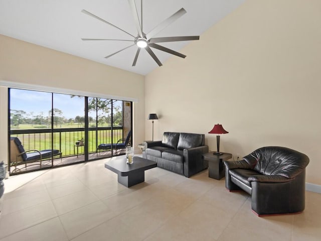 tiled living room with ceiling fan and vaulted ceiling