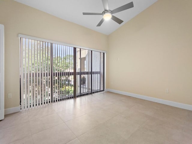 tiled empty room featuring lofted ceiling and ceiling fan