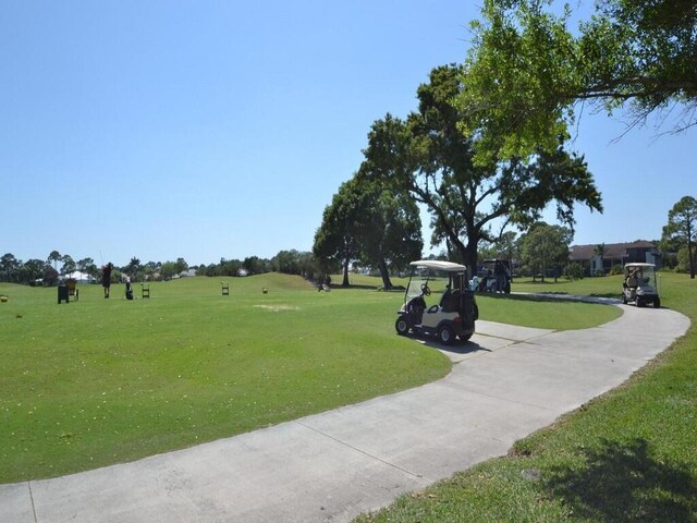 view of property's community featuring a lawn