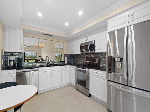 kitchen with crown molding, backsplash, stainless steel appliances, an inviting chandelier, and sink