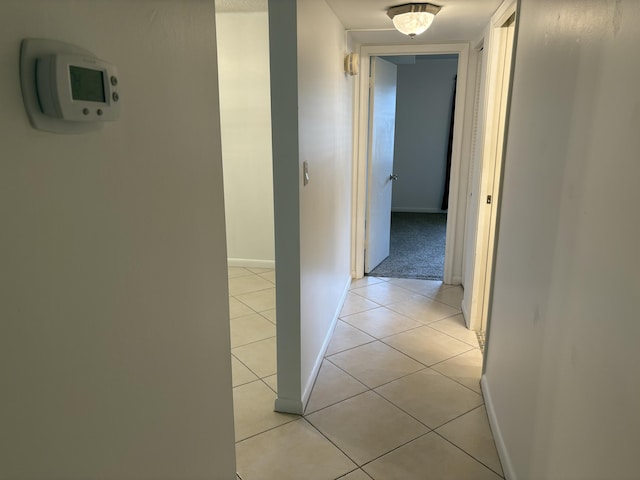 hallway with light tile patterned floors