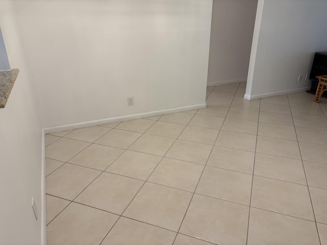 spare room with light tile patterned floors