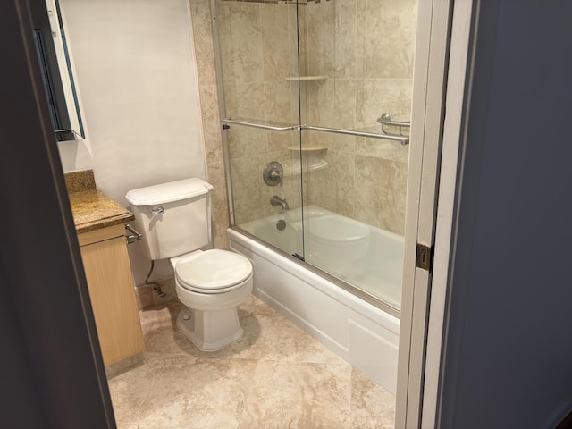 full bathroom featuring vanity, enclosed tub / shower combo, and toilet