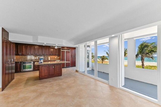 unfurnished living room featuring light tile floors