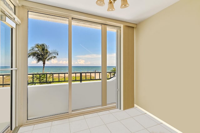 2800 S Ocean Blvd Unit 2-A, Boca Raton, FL 33432 - doorway to outside featuring baseboards, a water view, a notable chandelier, and a wealth of natural light